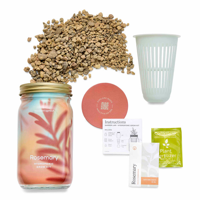 Image of a low-maintenance hydroponic grow kit by Modern Sprout, featuring their Garden Jar. It includes a stylish jar, rocks, net pot, fertilizer packet, instructions, rosemary seed packet, and terra cotta-colored coaster—perfect for effortless fresh herb cultivation.
