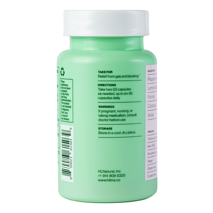The green plastic bottle of Hilma Gas + Bloat Relief displays instructions and promotes relief for gas and bloating using natural herbs. It includes dosage, storage advice, brand info, contact details, and a website for more information.