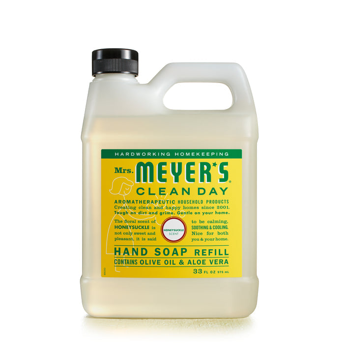 A 33 fl. oz. clear plastic jug of Mrs. Meyers Gel Hand Soap Refill, Honeysuckle scent, features a green label with essential oils, cruelty-free and aromatherapeutic qualities, and contains olive oil and aloe vera.