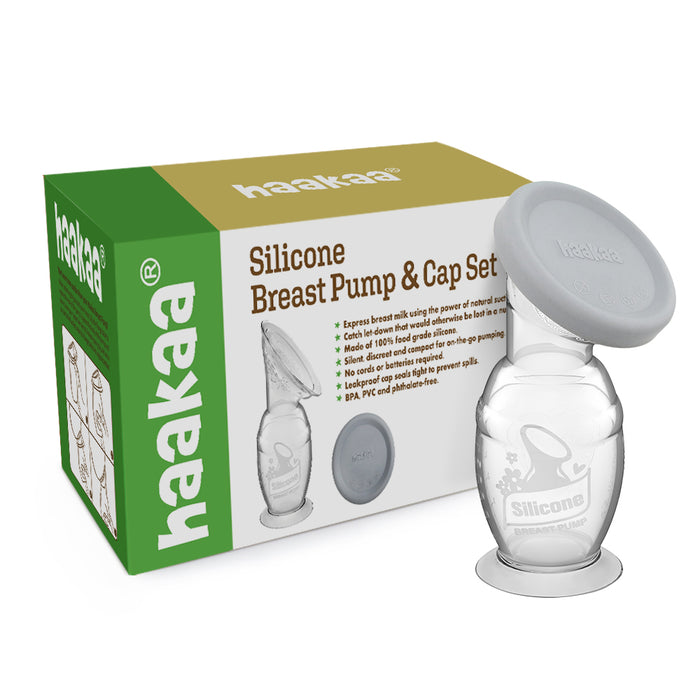 The Haakaa Generation 2 Silicone Breast Pump with Lid comes in green and white packaging, showcasing its components. Made from 100% food-grade silicone, it features a clear pump with a grey lid and usage illustrations on the box.
