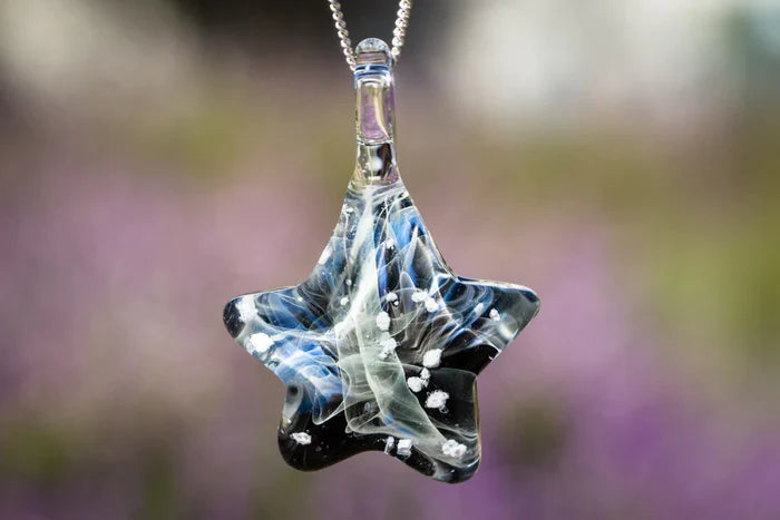 Star shaped Ghost glass pendant infused with cremation ashes on a silver chain