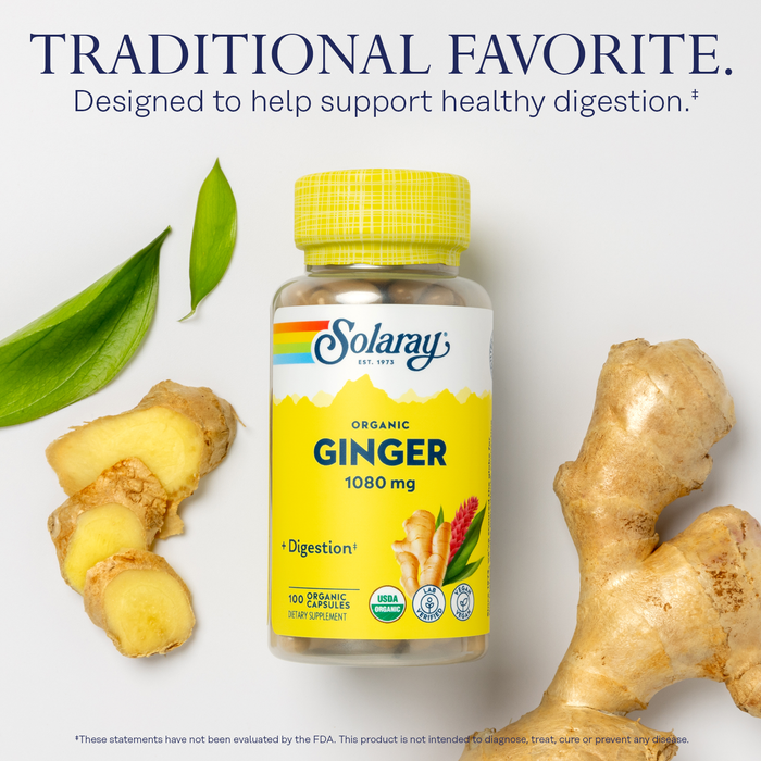 A bottle of Solaray Organic Ginger supplements is displayed alongside pieces of raw ginger and green leaves on a light gray surface. The text above reads "Traditional Favorite," highlighting its role in supporting healthy digestion.