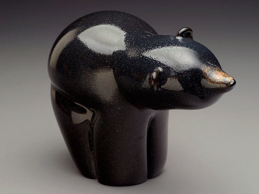 Glossy black glass bear sculpture infused with cremation remains