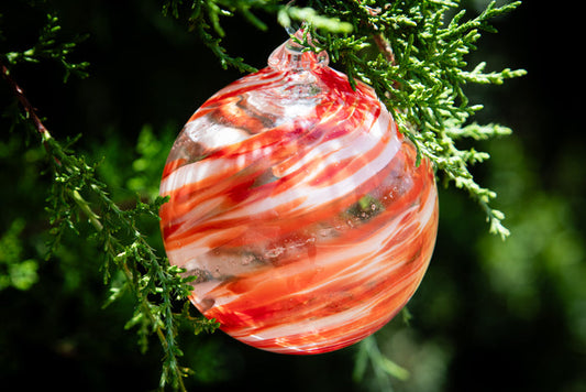 Christmas glass ornament with ash
