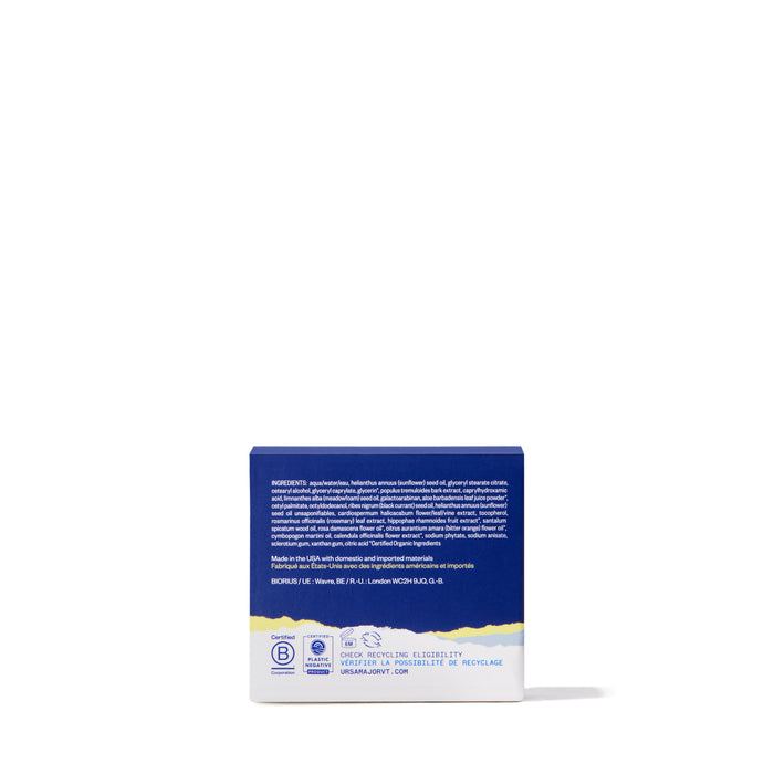 A blue and white Ursa Major Golden Hour Recovery Cream box, shown from the back with ingredients and company info, sits on a white surface. This facial moisturizer is popular for delivering deep hydration against a plain background.