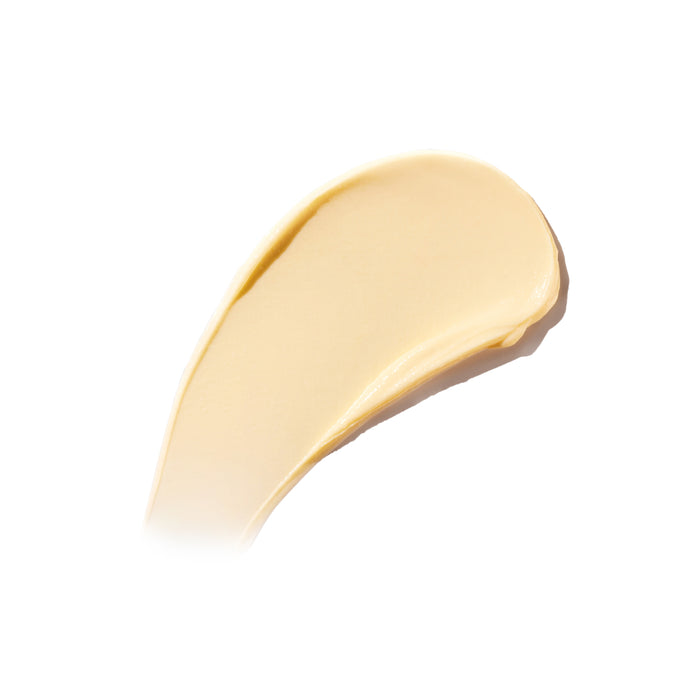 A creamy, beige smear of Ursa Major’s Golden Hour Recovery Cream sits on a white background, highlighting its smooth, glossy texture and the deep hydration this premium facial moisturizer offers.