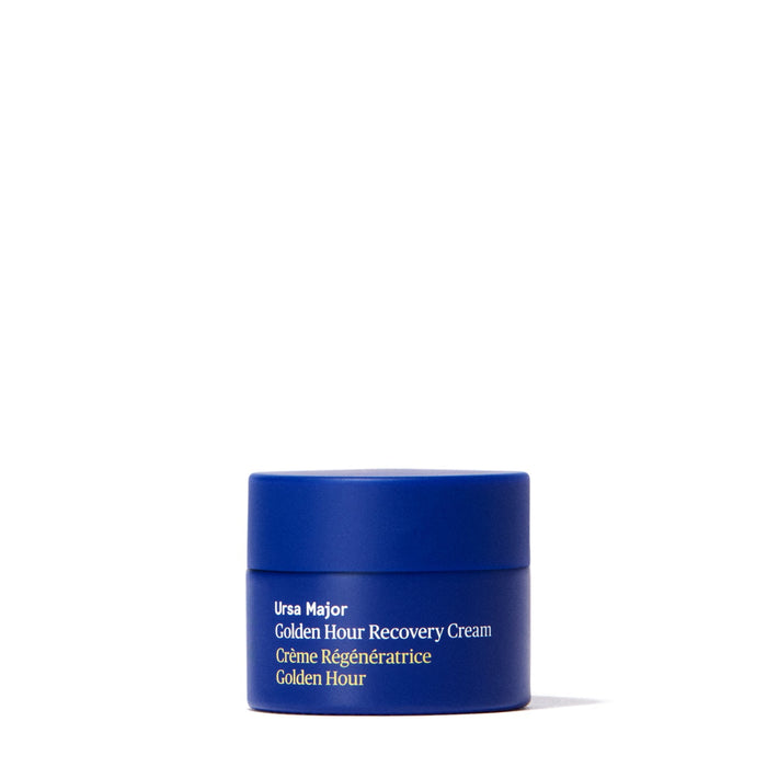 A small blue jar labeled Ursa Major Golden Hour Recovery Cream, a top natural facial moisturizer for deep hydration, is centered on a white background.