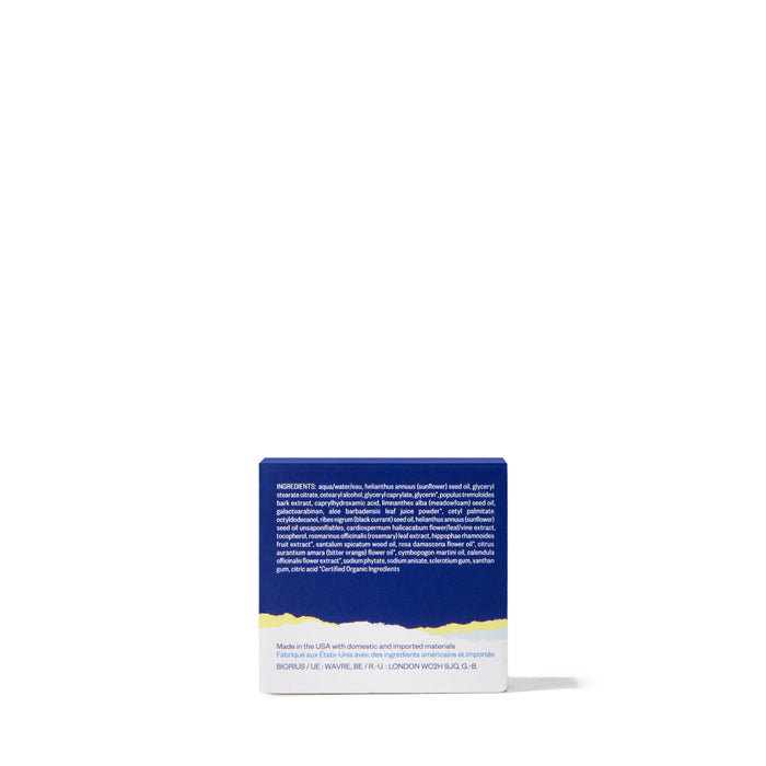 The back of a blue Ursa Major Golden Hour Recovery Cream box shows a white ingredients list and deep hydration details, highlighting this natural facial moisturizer, all set against a white background.