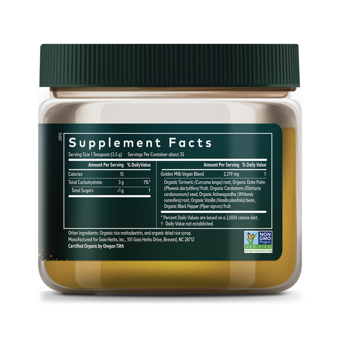 A green and white label on Gaia Herbs’ Golden Milk shows Supplement Facts: 9 calories, 1g carbs per serving, vegan and non-GMO certified—making this turmeric powder ideal for stress support.