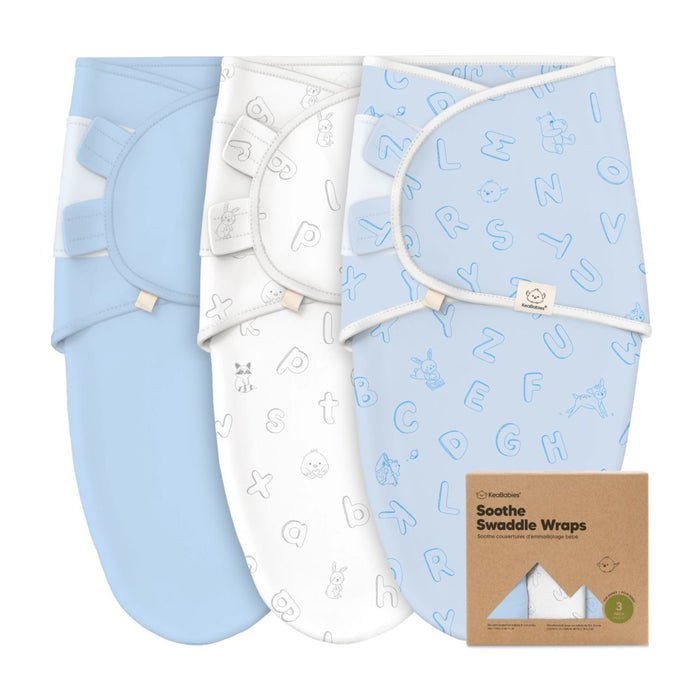 The KeaBabies GOTS Certified Soothe Swaddle Wraps, made of 100% organic cotton, feature a set of three wraps: solid light blue, white with animal outlines, and light blue with alphabet letters. They come in a brown box promoting comfort and sustainability.