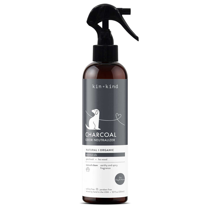 The kin+kind Grapefruit Coat Spray for Dog Smells, enhanced with mineral technology, features a dog silhouette label, showcasing its natural, organic pet-friendly formula. The spray bottle includes a black cap and trigger for easy application.