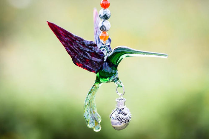 Handmade glass hummingbird with red and teal beads, crystal butterfly, and removable silver keepsake urn pendant