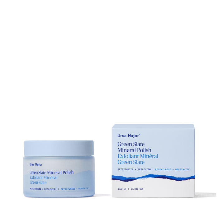 A jar and box of Ursa Major Green Slate Mineral Polish—a mineral-rich exfoliant for re-texturizing skin—are shown side by side on a white background, both in light blue packaging with dark blue accents and blue text.