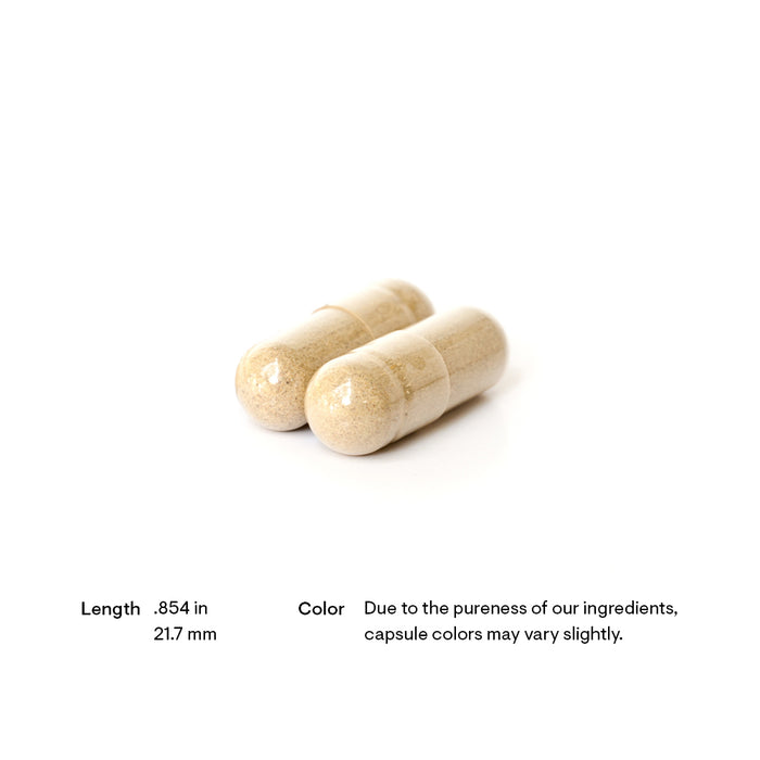 Two beige capsules placed on a white background with text indicating their length as 0.854 inches (21.7 mm). A note mentions that capsule colors may vary due to ingredient purity.