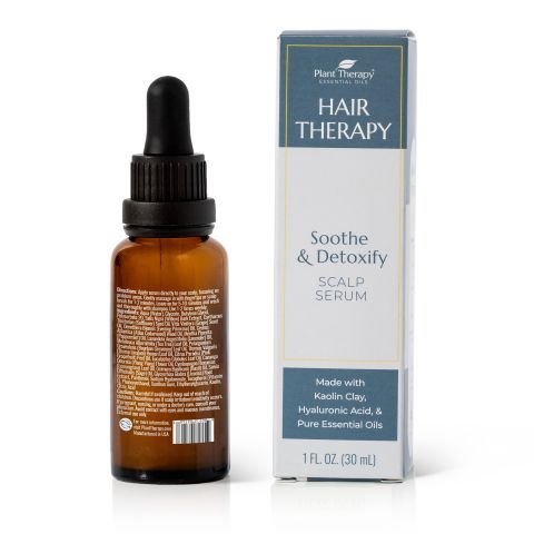 A brown dropper bottle labeled Hair Therapy Soothe & Detoxify Scalp Serum by Plant Therapy rests beside its box, featuring ingredients like Kaolin Clay, Hyaluronic Acid, and Pure Essential Oils. This 1 fl oz (30 ml) serum targets hair growth and revitalizes the scalp.