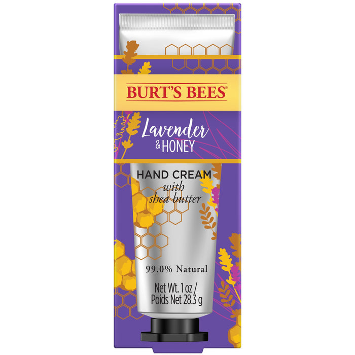Burts Bees Hand Cream with Shea Butter in a purple box adorned with yellow and orange floral and honeycomb designs is 99.0% natural, weighs 1 oz (28.3g), and contains Lavender & Honey, packaged beautifully for a soothing touch.