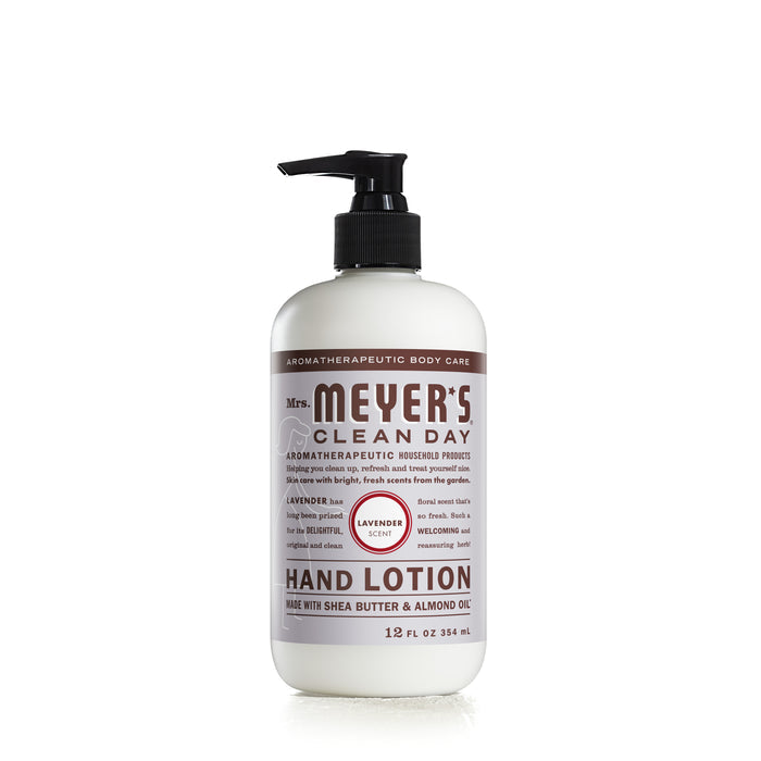 A 12 fl oz Mrs. Meyers Hand Lotion in lavender scent comes in a white bottle with a black pump and brown label, featuring a blend of shea butter and almond oil for soothing aromatherapeutic body care benefits.