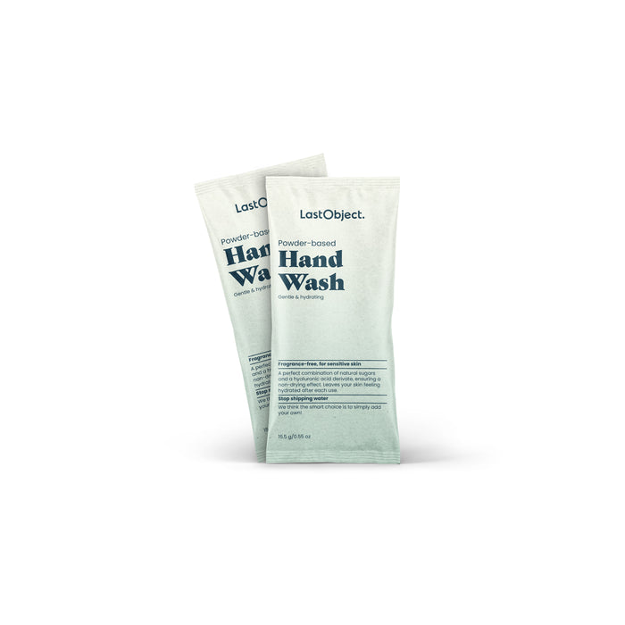 Two packets of LastObject Handwash Refill, ideal for sensitive skin, sport a minimalist design with black text on pale green. They highlight gentleness and hydration while cutting down plastic waste. Each packet includes usage instructions.