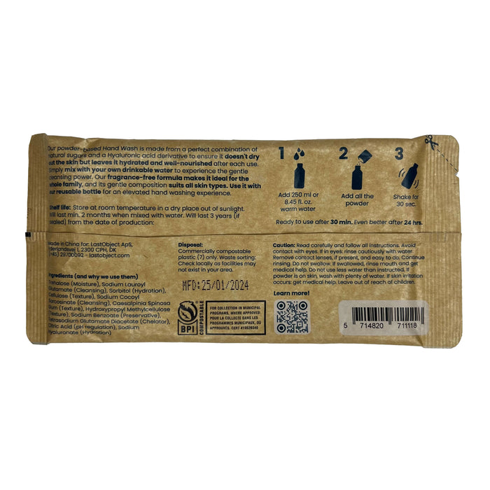LastObjects Handwash Refill comes in a brown packet with instructions and details. Mix by adding water, powder, shake, and use. It contains natural sugars for extra care and includes product ingredients, manufacturing date, and symbols for disposal and compostability.