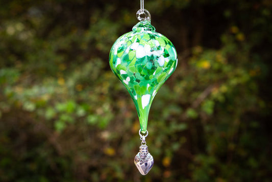 Green teardrop glass ornament with a hanging silver keepsake urn pendant