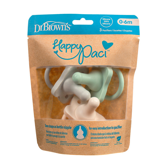 Dr. Browns HappyPaci silicone pacifiers for ages 0-6 months feature a butterfly-shaped shield and come in brown packaging with a clear front, displaying three pastel, easy-to-clean pacifiers designed to resemble a bottle nipple for seamless transition.