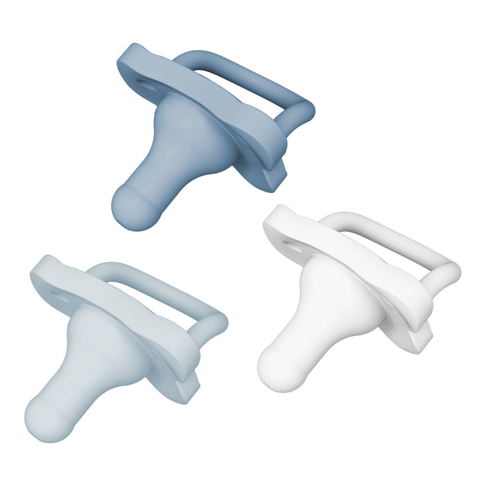 Three Dr. Browns HappyPaci silicone pacifiers, suitable for 0-6 months and featuring handles with a butterfly-shaped shield, are arranged in a triangular pattern on a white background. They are easy to clean and come in light blue, dark blue, and white.