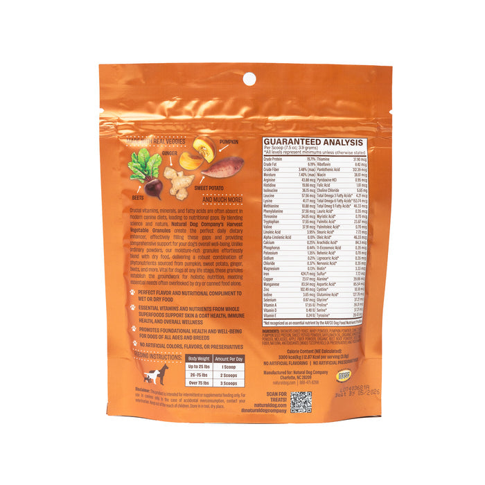 The Harvest Vegetable Superfood Granules by Natural Dog Company come in an orange resealable bag with sweet potato and spinach illustrations. It features nutritional info on the back, small dog and cat icons at the bottom, and a convenient top cutout, perfect as a meal topper.