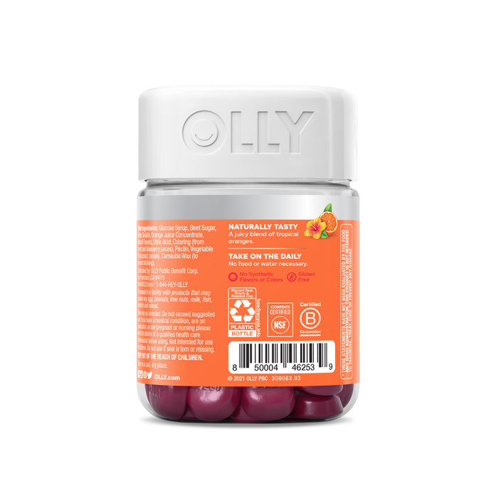The OLLY Heavenly Hair gummies come in a transparent bottle with a white lid and an orange label that emphasizes the benefits of Biotin and Keratin, along with ingredient details and daily usage instructions.