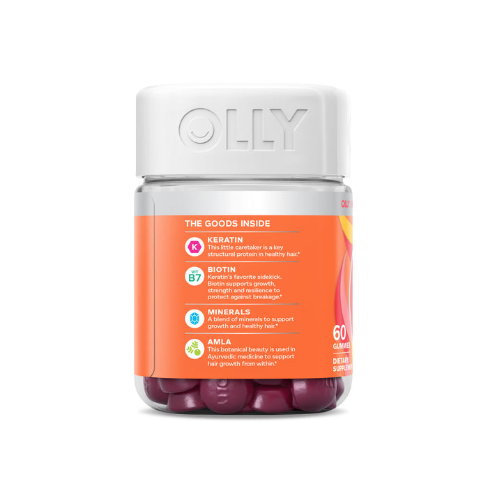 The OLLY Heavenly Hair gummies come in a jar with a white lid, featuring key ingredients like Keratin, Biotin, Minerals, and Amla for hair health. It contains 60 gummies.
