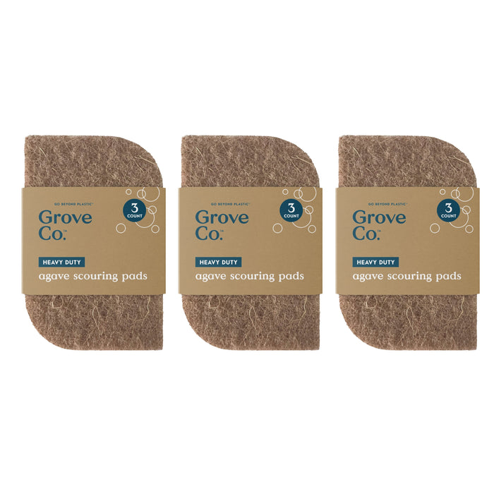 Three packs of Grove Co. Heavy-Duty Agave Scouring Pads are shown side by side. Each pack contains three brown, rectangular pads made from agave fibers with rounded corners and eco-friendly packaging.