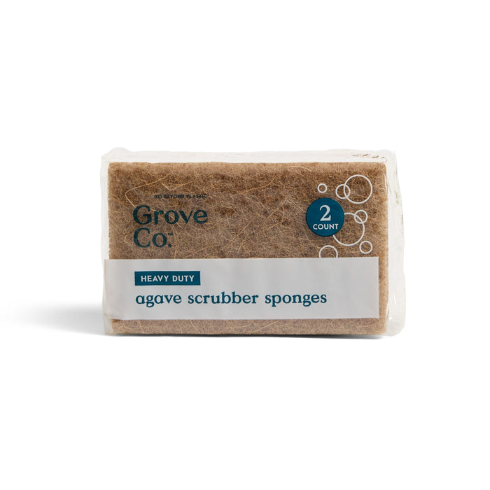 A clear package of Grove Co. Heavy Duty Agave Scrubber Sponge contains two sponges, featuring a label with the brand and product name.