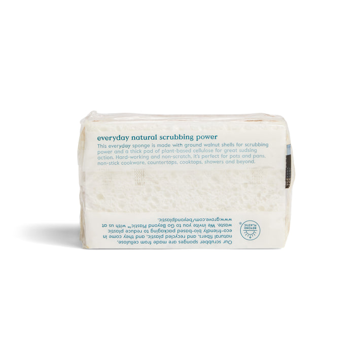A rectangular Heavy Duty Agave Scrubber Sponge by Grove Co. with a textured surface, wrapped in semi-transparent packaging featuring blue and green text highlighting its effective cleaning power and natural materials.
