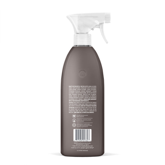 A brown method spray bottle with a white trigger nozzle, viewed from the back, is perfect as a kitchen degreaser. It features white text, a barcode, and recycling symbols. The transparent cap reveals the Heavy Duty Degreaser inside.
