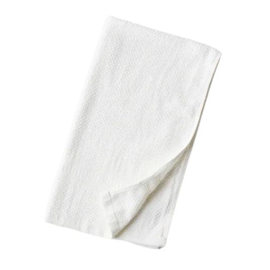 A Hemp and Organic Cotton Hand Towel by Anact, featuring a soft white texture, rounded edges, and a fluffy, absorbent feel, is neatly folded against a white background.