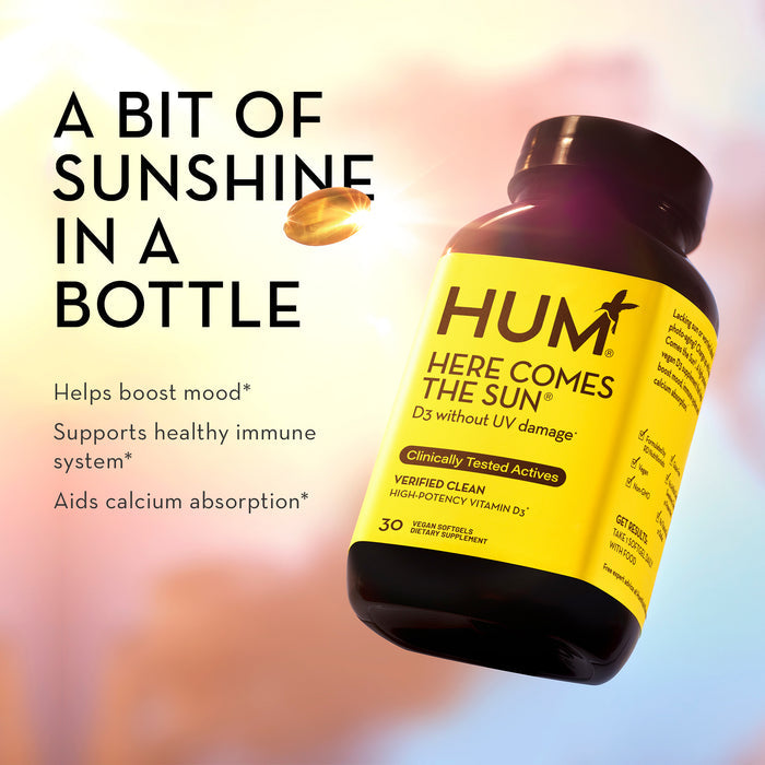 A bottle of HUM Here Comes The Sun Vitamin D3 supplement is shown against a sunny background. Text reads: "A bit of sunshine in a bottle. Helps boost mood*, supports healthy immune system*, aids calcium absorption*." The bottle contains 30 softgels.