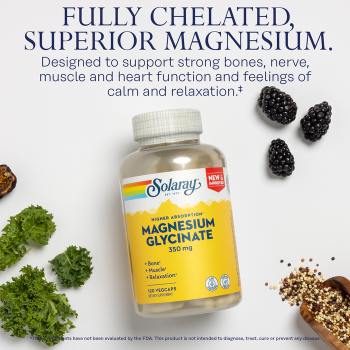 A bottle of Solaray Magnesium Glycinate 350 mg on a white surface, surrounded by blackberries, curly parsley, a spoonful of black seeds, and herbs. Text highlights its benefits for bones, nerves, muscles, and heart health, promoting calmness and relaxation.