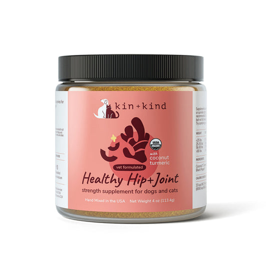The kin+kind Hip & Joint Mobility Support Powder Supplement for dogs and cats, made in the USA and vet-formulated, acts as an anti-inflammatory supplement. Packaged in a 4 oz container, its label showcases a dog and cat silhouette with organic coconut and turmeric text highlights.