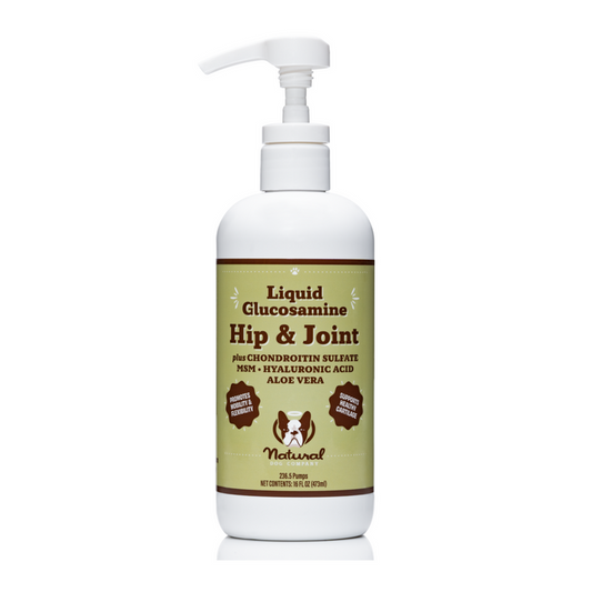 A white pump bottle from Natural Dog Company is labeled Hip & Joint Oil for pets, containing chondroitin sulfate, MSM, hyaluronic acid, and aloe vera. The label features dog and cat silhouettes highlighting its natural benefits for canine joint support.