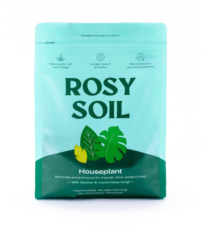 A turquoise bag of Rosy Soils Houseplant Potting Soil boasts sustainable packaging with leaf illustrations, emphasizing benefits like microbial activity and soil aeration, using sustainable ingredients without peat moss or synthetics.