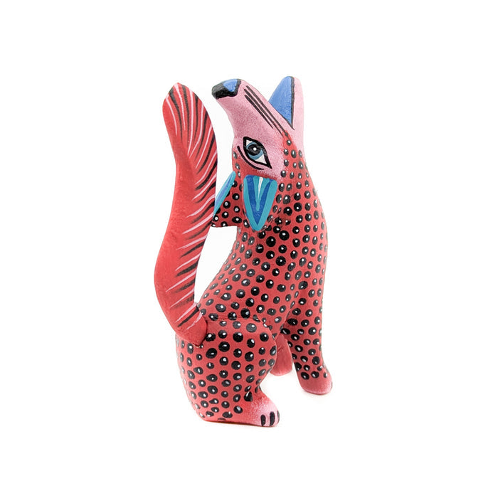 Howling Red and Black Spotted Coyote