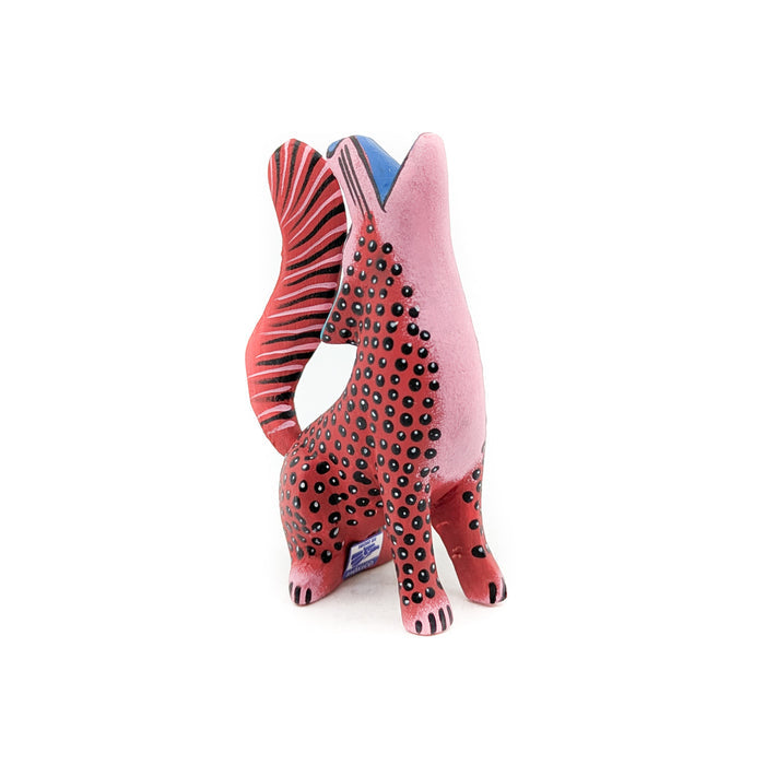 Howling Red and Black Spotted Coyote