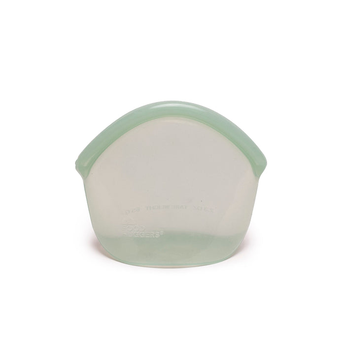 A Hugger Bag from Food Huggers is shown against a plain white background. Its a translucent green silicone food storage bag with a rounded top and flat base, dishwasher safe, easy to clean, and stylish for everyday use.