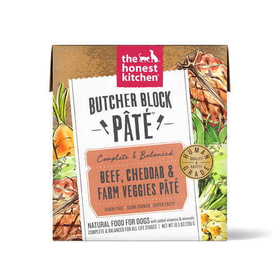 The image displays The Honest Kitchens Beef, Cheddar & Veggies Wet Dog Food packaging. This natural dog food with ranch-raised beef, cheddar, and vegetables features a box with vegetable illustrations and labels like human grade and complete & balanced.