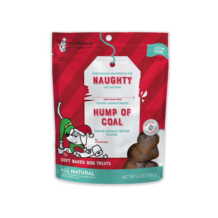 Shameless Pets Hump of Coal Soft Baked Biscuit Dog Treats, Naughty List comes in a festive red and green pouch with holiday graphics featuring a grinning dog in a Santa hat. These treats have natural carob and peanut butter flavors.
