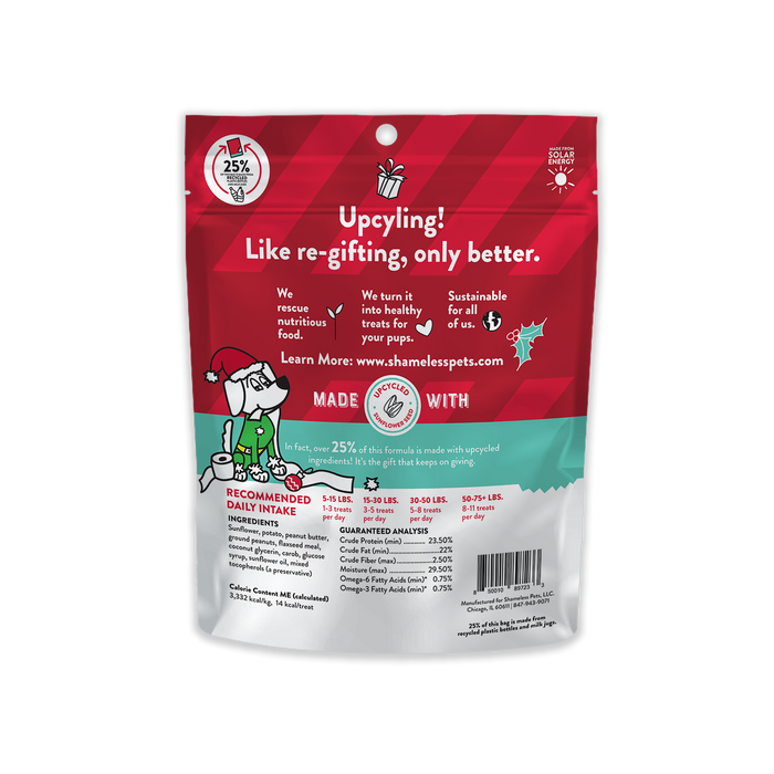 Shameless Pets Hump of Coal Soft Baked Biscuit Dog Treats feature a festive design and emphasize upcycled ingredients like natural carob, promoting eco-friendly practices. Nutritional info and feeding guidelines are visible on the back.