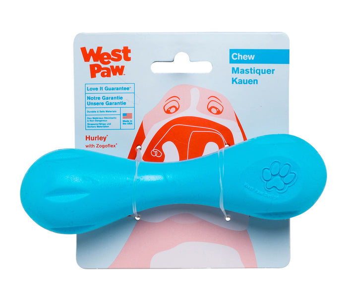 The West Paw Hurley® Super Chewers Dog Bone Toy, in blue and dishwasher-safe, reduces pet anxiety and boredom. Made from zero-waste plastic, it comes on a card with a dogs face and displays Chew, Mastiquer, Kauen, plus the West Paw logo.