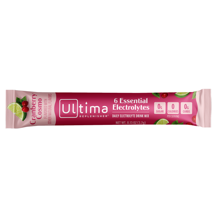 A packet of Ultima Replenisher Hydration Electrolyte Pouch in Cranberry flavor boasts 6 Essential Electrolytes, with 0g sugar, 0 calories, and 0g carbs per serving, perfect for any Mocktini Drink Mix Variety Pack, packaged in a pink design featuring cranberries and lime slices.
