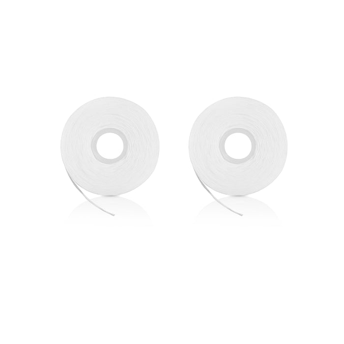 Two Davids Expanding Dental Floss refills lie side by side on a white background, resembling rolls of transparent adhesive tape. Each refill has a smooth, glossy finish with the floss slightly extended from the inner circle.