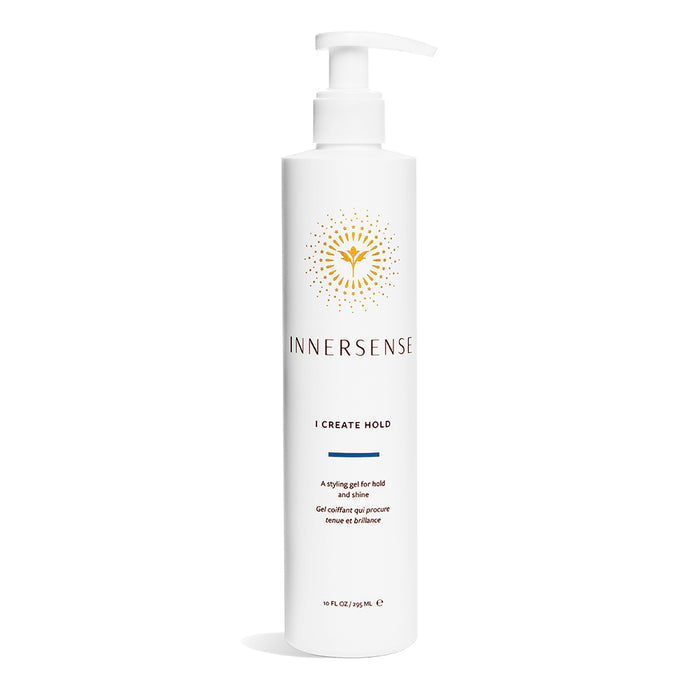 A 10 fl oz tall white bottle of Innersense Organic Beautys I Create Hold styling gel, enriched with aloe and honey for antioxidant rejuvenation. It has a pump dispenser, a gold sunburst logo, and text promoting its hold and shine benefits.