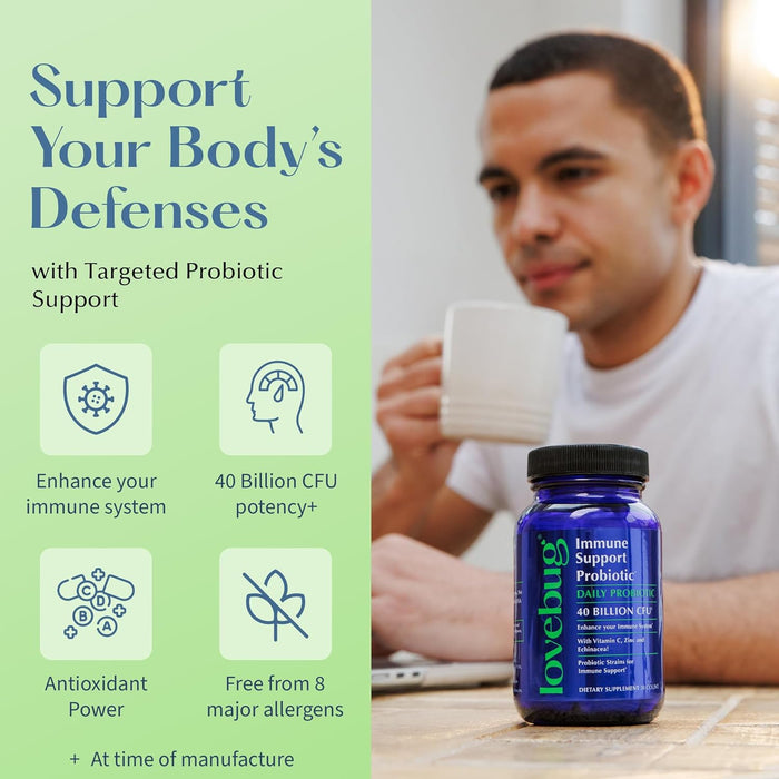 A man sits at a table with a cup, while a bottle of Lovebug Immune Support Probiotic is in focus. Text highlights immune support, 40 billion CFU, antioxidant power, free from 8 allergens, and made at time of manufacture.